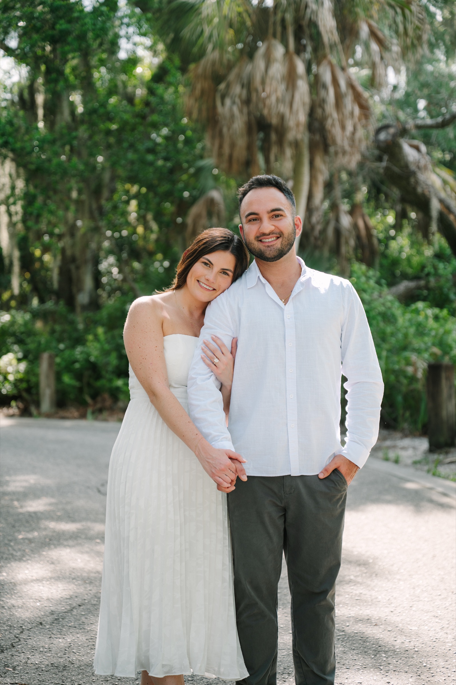 Katelyn and Sergio smiling together outdoors